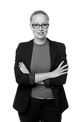 Image showing Business woman standing with arms crossed against white background..