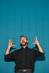 Image showing Portrait of young man with shocked facial expression