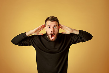 Image showing Portrait of young man with shocked facial expression