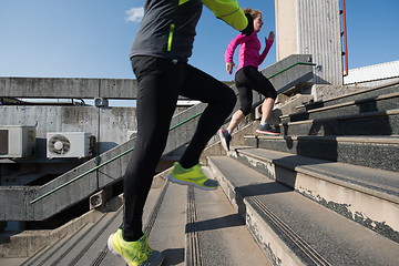 Image showing young  couple jogging on steps