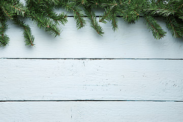 Image showing Fir branches decorated white wooden board. Christmas, new year background