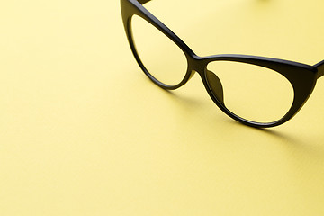 Image showing Glasses in empty yellow background