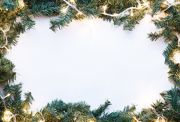 Image showing Branches of spruce with garland