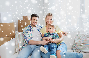 Image showing happy family with boxes moving to new home