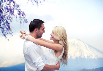 Image showing happy couple hugging  over fuji mountain in japan