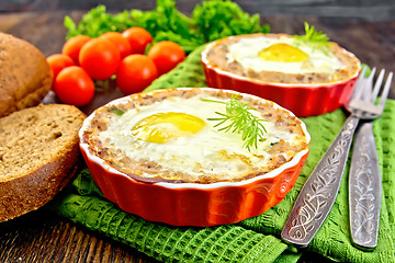 Image showing Tartlet meat with egg in pan on board