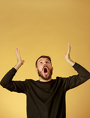 Image showing Portrait of young man with shocked facial expression