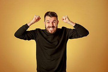 Image showing The young man looking at camera