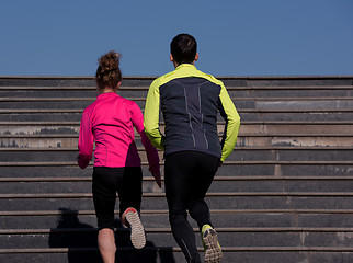 Image showing young  couple jogging on steps