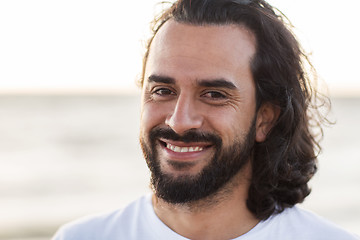 Image showing happy smiling man with beard outdoors