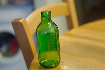 Image showing Empty bottle on table