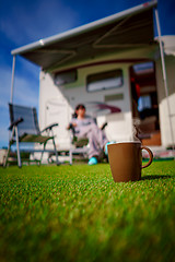 Image showing Coffee Mug on grass. Family vacation travel, holiday trip in mot