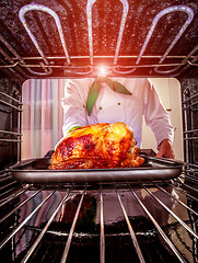 Image showing Cooking chicken in the oven.