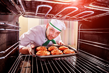 Image showing Chef cooking in the oven.