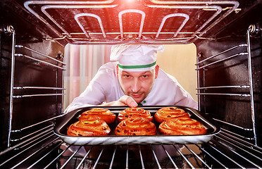 Image showing Chef cooking in the oven.