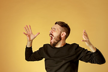 Image showing Portrait of young man with shocked facial expression