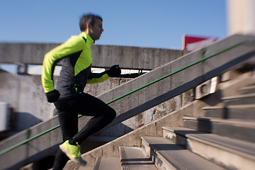 Image showing man jogging on steps