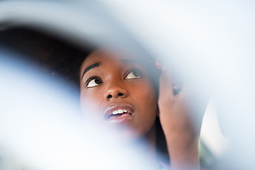 Image showing woman making makeup while driving car