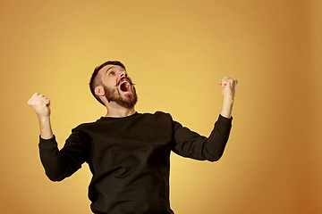 Image showing The young man looking at camera