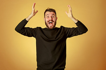 Image showing The young happy man looking at camera