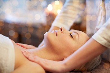 Image showing close up of woman lying and having massage in spa