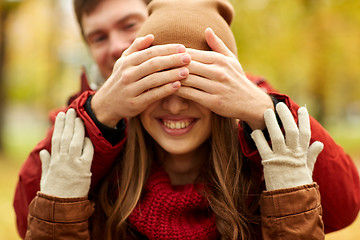 Image showing happy young couple having fun in autumn park