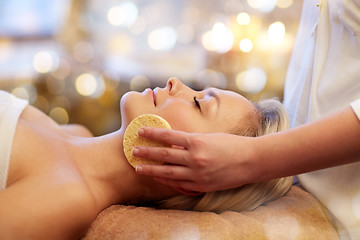 Image showing close up of woman having face massage in spa