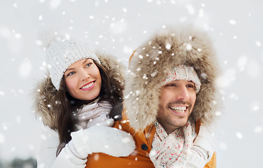 Image showing happy couple having fun over winter background