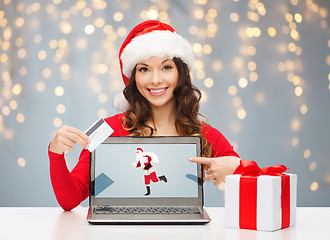 Image showing woman in santa hat with laptop and credit card