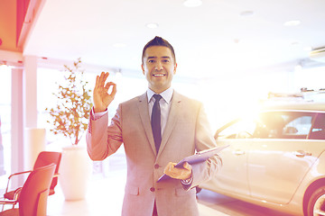 Image showing happy man at auto show or car salon