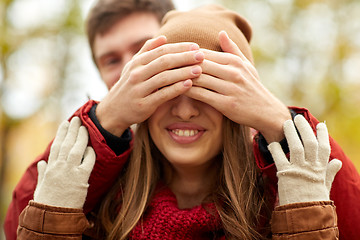 Image showing happy young couple having fun in autumn park