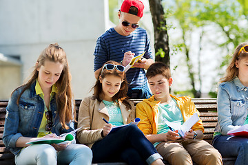 Image showing group of students with notebooks at school yard