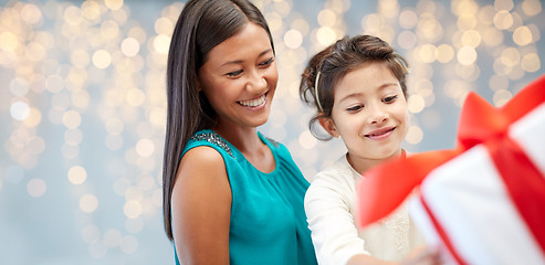 Image showing happy mother and child girl with gift box