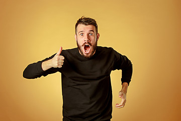 Image showing Portrait of young man with shocked facial expression