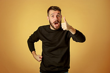 Image showing The young happy man looking at camera