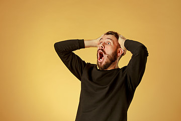 Image showing Portrait of young man with shocked facial expression