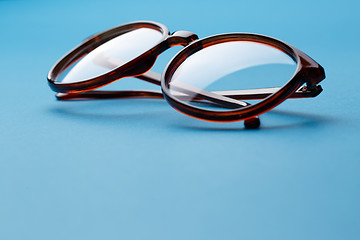 Image showing Folded brown spectacles close up