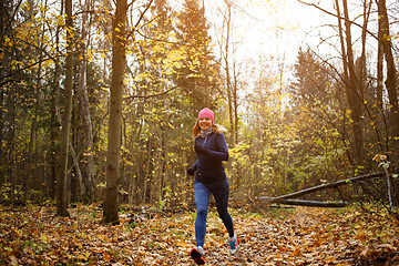 Image showing Slender woman running in park