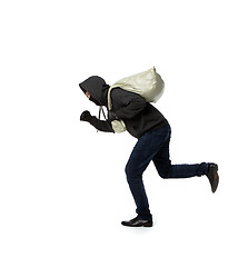 Image showing Thief escapes with full bag