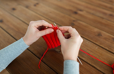 Image showing woman hands knitting with needles and yarn