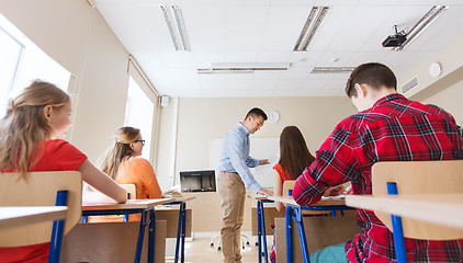 Image showing group of students and teacher with test results