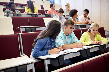 Image showing group of students with notebooks at lecture hall