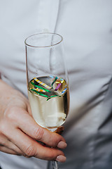 Image showing Close up crop hand with wineglass
