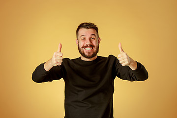 Image showing The young happy man looking at camera