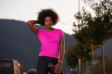 Image showing Portrait of a young african american woman running outdoors