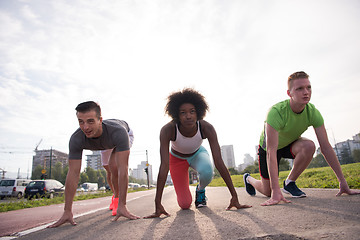 Image showing multiethnic group of people on the jogging