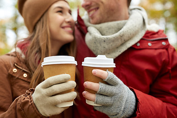 Image showing close up of happy couple with coffee in autumn