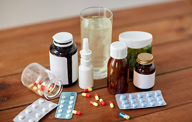 Image showing medicine and drugs on wooden table