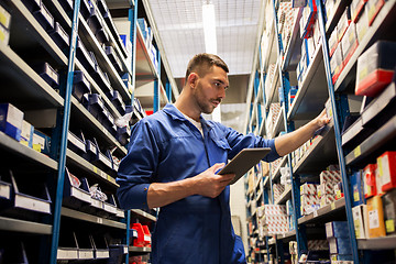 Image showing auto mechanic or smith with tablet pc at workshop