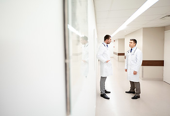 Image showing male doctors talking at hospital corridor
